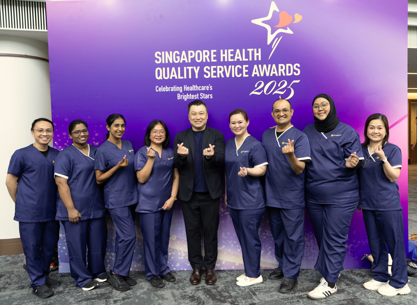 Fullerton Health (SG) Managing Director Derrick Chan (middle) together with other awardees from Fullerton Health